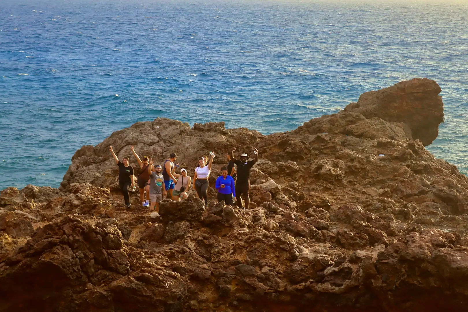 Hikers on the rugged Sero Colorado coastline