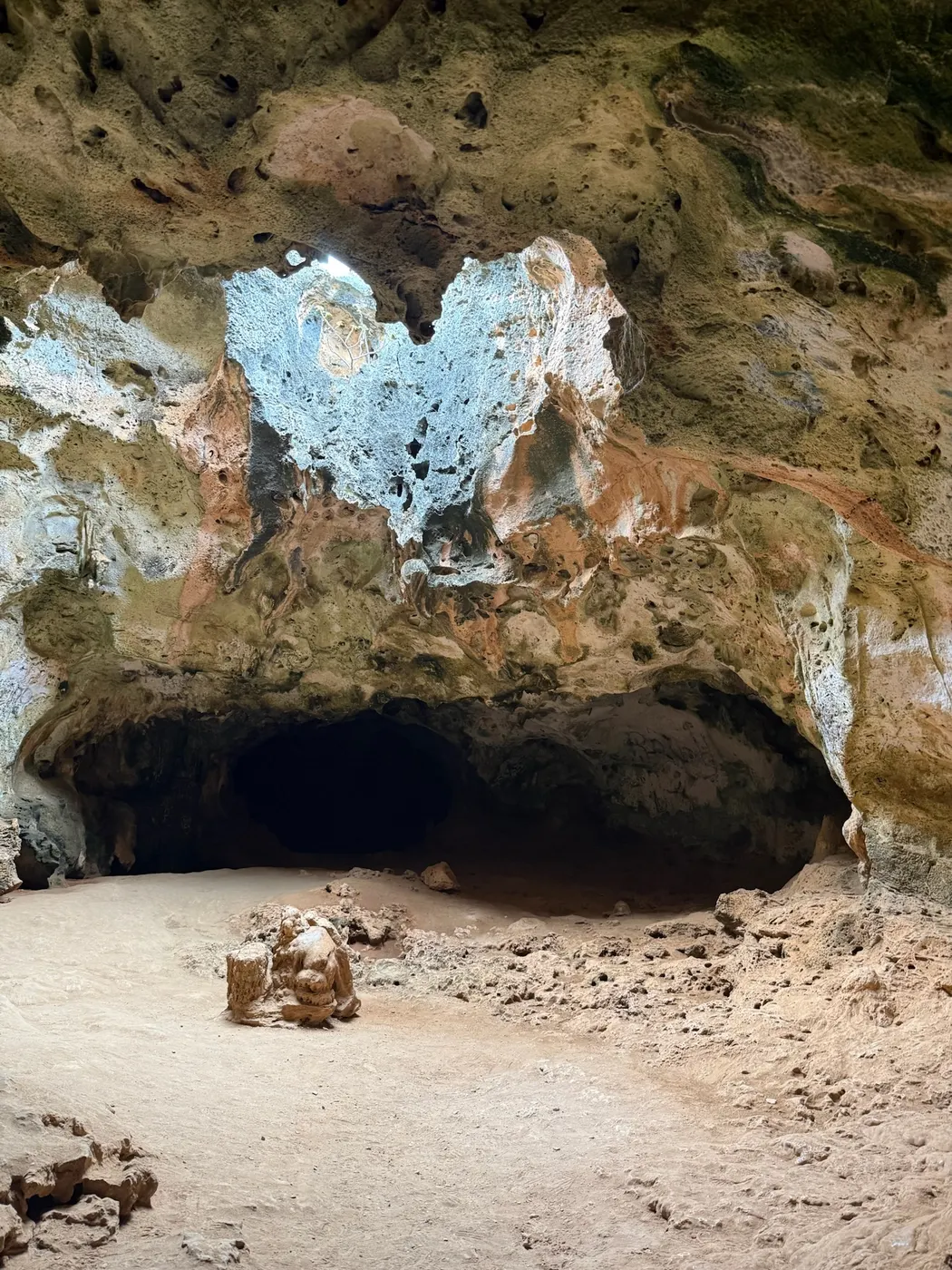 Sunlight streaming into a cave chamber