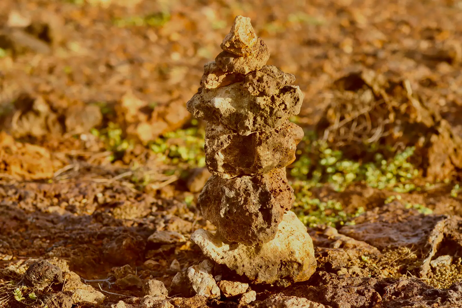 Stacked rock cairn in Aruba desert
