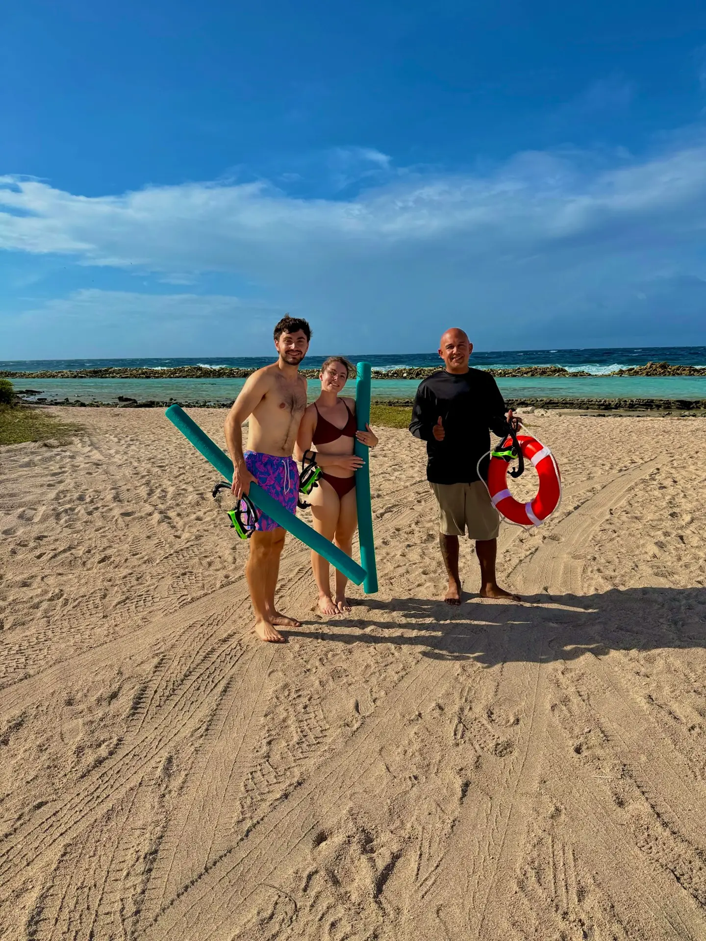 Guests with snorkel gear ready at Baby Beach