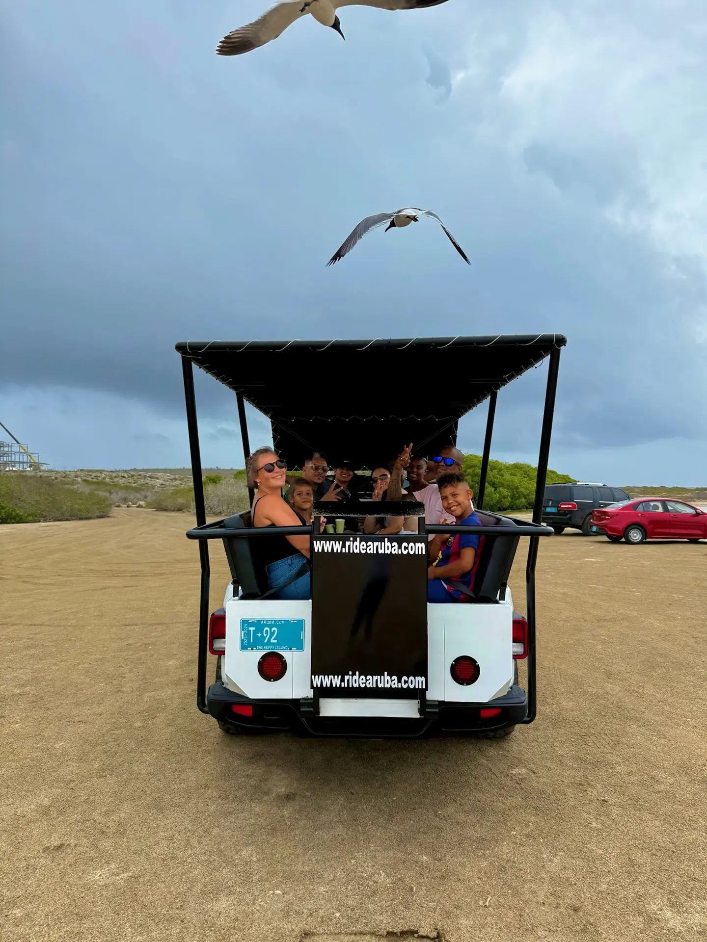 Happy group riding in the safari jeep