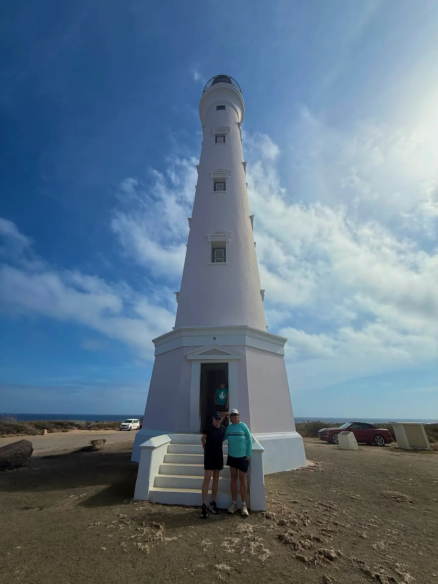 Guests posing at the base of the California Lighthouse